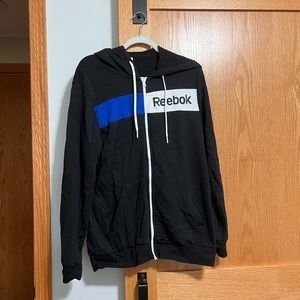 Reebok zip up hoodie in black. Size medium.
